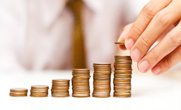 a man rising coins; Shutterstock ID 98277623; PO: aol; Job: production; Client: drone